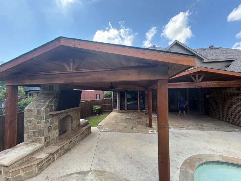 Gable cedar patio cover beside a pool