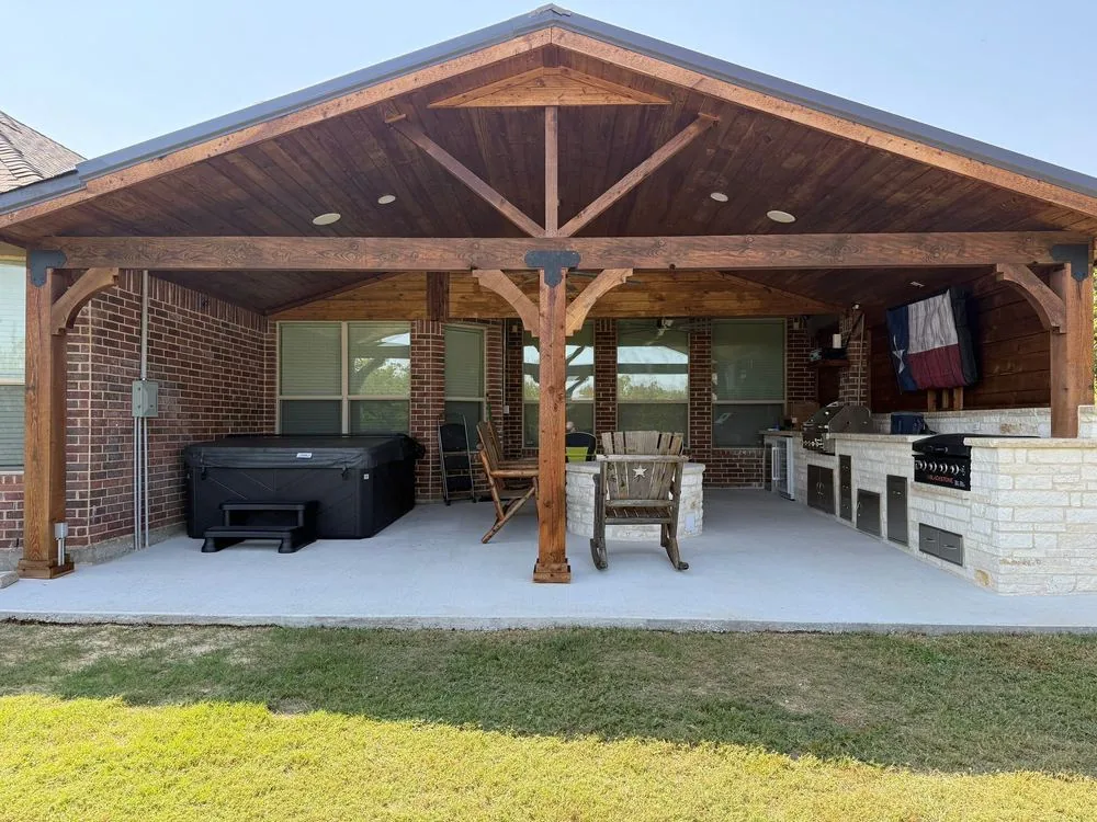 Large cedar gable pavilion with hot tub, seating and outdoor kitchen