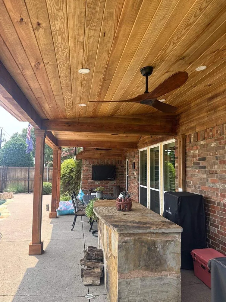 Cedar patio cover with stone bar and fireplace